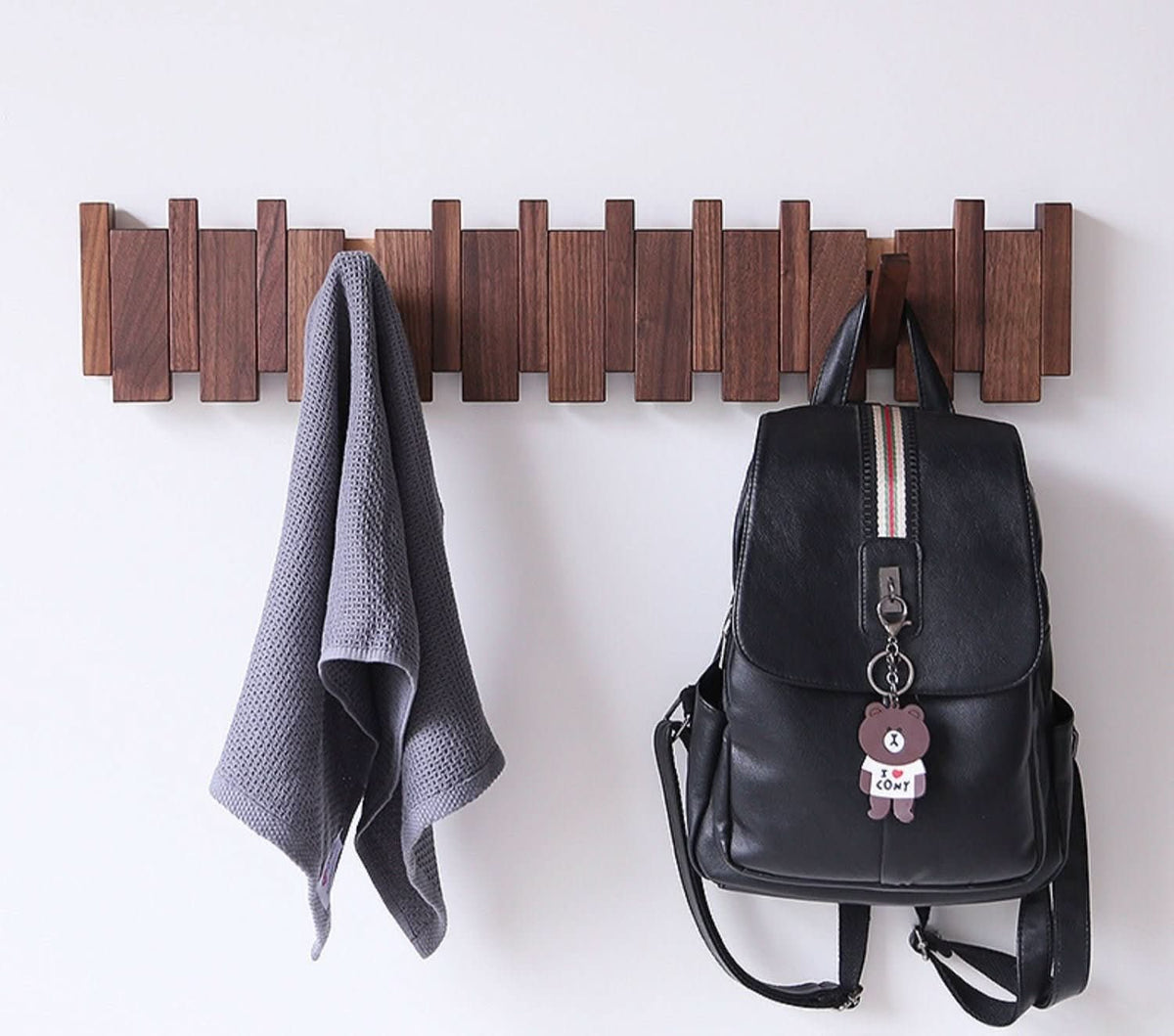 handcrafted-piano-inspired-wooden-wall-coat-rack-with-foldable-hooks-img1.jpg